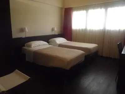 Letto o letti in una camera di Hotel Bersè