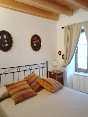 Letto o letti in una camera di B&B Castello Malaspina di Tresana