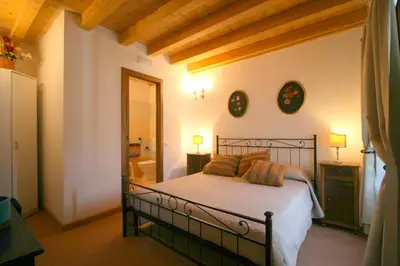 Letto o letti in una camera di B&B Castello Malaspina di Tresana