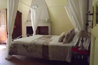Letto o letti in una camera di B&B Il Tempo Del Vento in front of the Castle