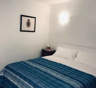 Letto o letti in una camera di [Storico] Ombelico di Parma