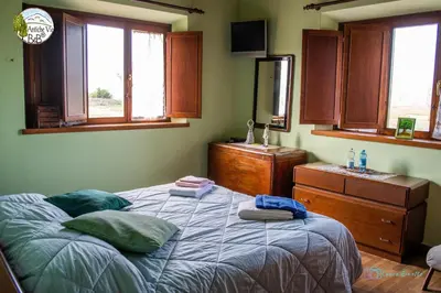 Letto o letti in una camera di Antiche Vie B&B