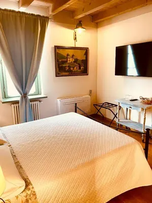 Letto o letti in una camera di La Casina