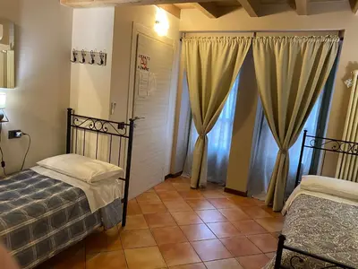 Letto o letti in una camera di La Casina