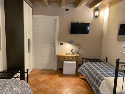 Letto o letti in una camera di La Casina