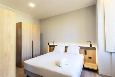 Letto o letti in una camera di Palazzo Le Poste - Suite and Apartments