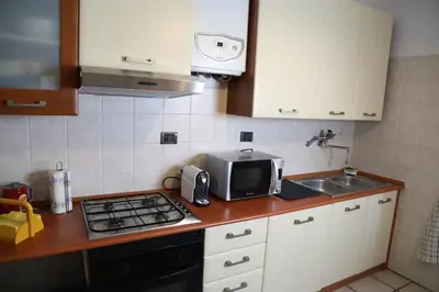 Cucina o angolo cottura di LA DIMORA DEGLI ELFI casa vacanza
