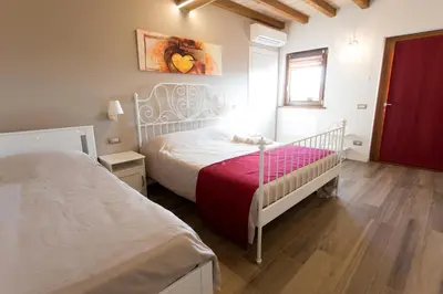 Letto o letti in una camera di Ca' del Passero b&b
