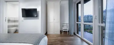 Letto o letti in una camera di B&B Campari 10
