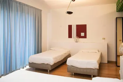 Letto o letti in una camera di Park Hotel Residence