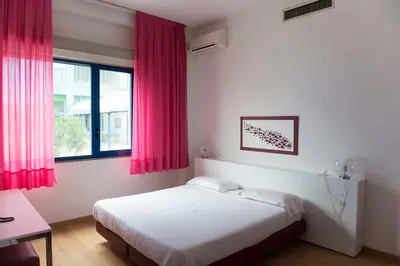 Letto o letti in una camera di Park Hotel Residence