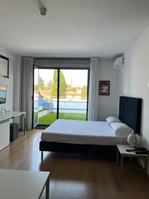 Letto o letti in una camera di Park Hotel Residence