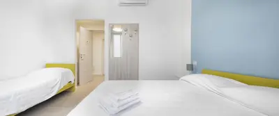 Letto o letti in una camera di b&b Amaca