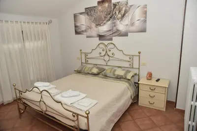 Letto o letti in una camera di Casa Emanuela, Il nostro Nido d'amore