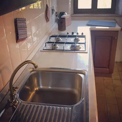 Cucina o angolo cottura di Romantic apartment garden parking in Parma city Villa Podere Merlo