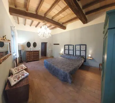 Letto o letti in una camera di Romantic apartment garden parking in Parma city Villa Podere Merlo