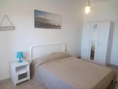Letto o letti in una camera di Profumo di Mare CIN ITO1OO59C2HKBFVVXS