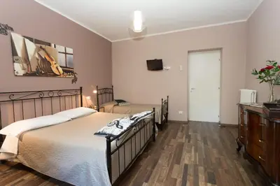 Letto o letti in una camera di Segui le note della Tua vita
