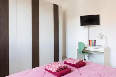 Letto o letti in una camera di GuestHost - Parma Railway Station Lovely Apartment