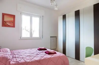 Letto o letti in una camera di GuestHost - Parma Railway Station Lovely Apartment
