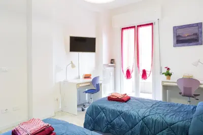Letto o letti in una camera di GuestHost - Parma Railway Station Lovely Apartment