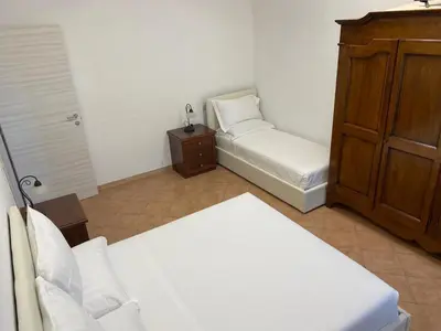 Letto o letti in una camera di B&B Giulia