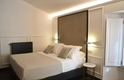 Letto o letti in una camera di PALAZZO DELLE SIRENE Deluxe Apartment & Boutique Rooms