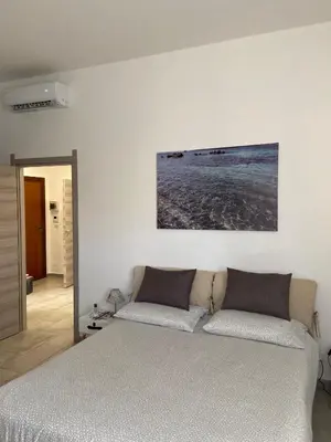 Letto o letti in una camera di casa Nenne appartamento con due camere da letto