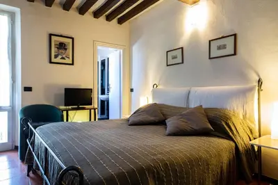 Letto o letti in una camera di B&B AL DUCALE and APARTMENTS
