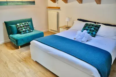Letto o letti in una camera di La Torretta Boutique Accommodation
