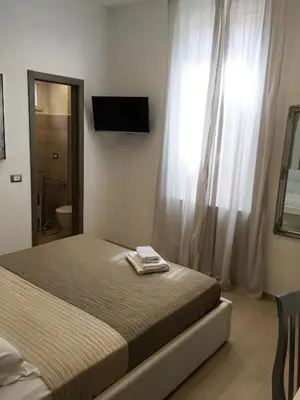 Letto o letti in una camera di Maestrale Charme Rooms