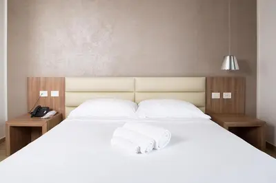 Letto o letti in una camera di Hotel Al Veliero