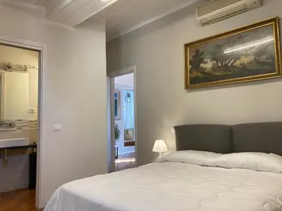 Letto o letti in una camera di la suite di via Mazzini