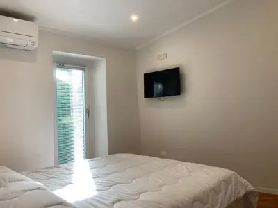 Letto o letti in una camera di la suite di via Mazzini