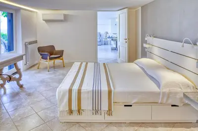 Letto o letti in una camera di GIARDINO SUL MARE House - Levanto Sea View