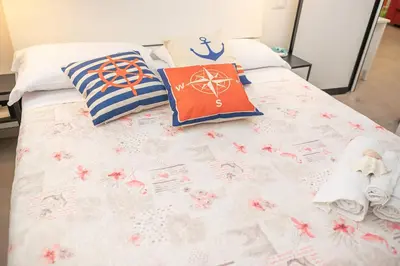 Letto o letti in una camera di 069 - Casa TRAMONTO, in CENTRO, 450metri da Mare Spiaggia