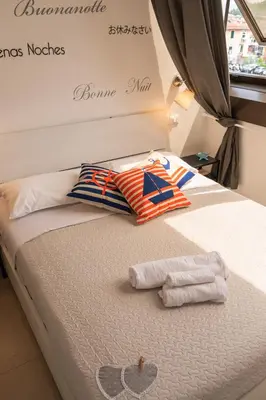Letto o letti in una camera di 068 - Casa STELLA MARINA in CENTRO, 450metri da Mare e Spiaggia