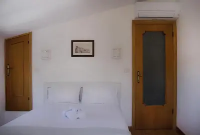 Letto o letti in una camera di Nonna Maria