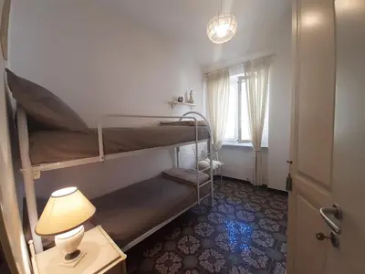 Letto o letti in una camera di House La Baia delle Favole by Holiday World