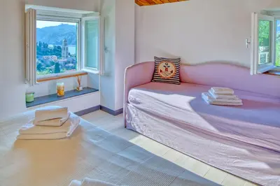 Letto o letti in una camera di il Frantoio del Mesco - Levanto
