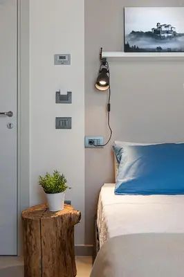 Letto o letti in una camera di Le Ferrerie agriturismo fattoria Marchesini