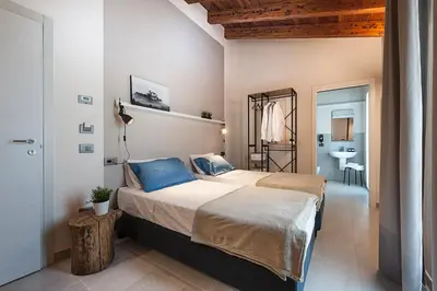 Letto o letti in una camera di Le Ferrerie agriturismo fattoria Marchesini