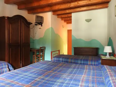 Letto o letti in una camera di Affittacamere 