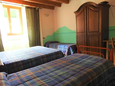 Letto o letti in una camera di Affittacamere 