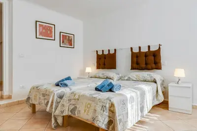 Letto o letti in una camera di GuestHost - La Spezia Migliarina Bedrooms