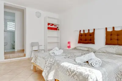 Letto o letti in una camera di GuestHost - La Spezia Migliarina Bedrooms