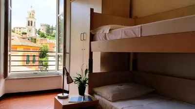 Letto o letti in una camera di Ospitalia del Mare Hostel