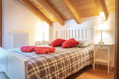 Letto o letti in una camera di Mansarda Villa Adele