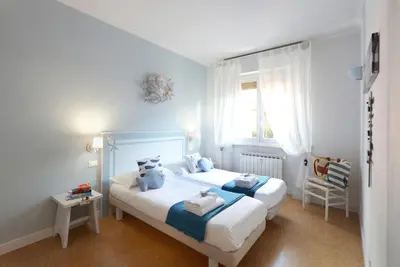 Letto o letti in una camera di casa enrica