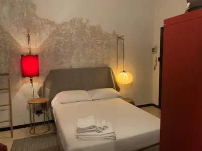Letto o letti in una camera di Mood-Garibaldi